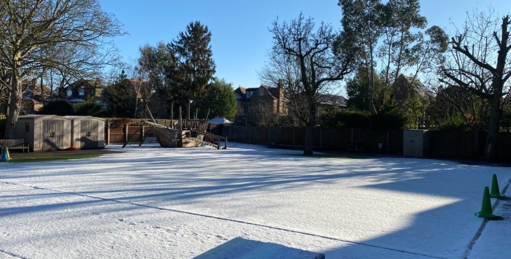 snow across a school playground