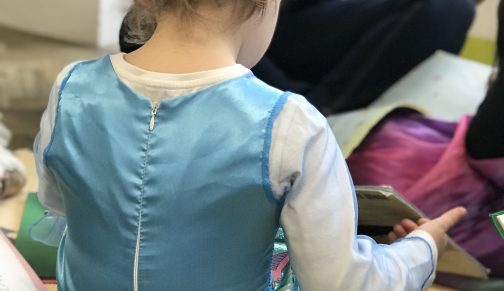 Reception girl reading book